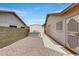 Backyard featuring a built-in BBQ station, shed, and low-maintenance gravel, ideal for outdoor cooking and storage at 17500 N 85Th Dr, Peoria, AZ 85382