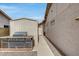 Built-in BBQ station in backyard, next to storage shed, offering a functional outdoor space at 17500 N 85Th Dr, Peoria, AZ 85382