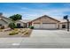 Charming single-story home with a three-car garage and a well-manicured desert front yard at 17500 N 85Th Dr, Peoria, AZ 85382