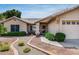 Inviting home exterior features a manicured desert landscape and a covered entryway at 17500 N 85Th Dr, Peoria, AZ 85382