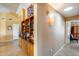 Hallway with tile flooring and decorative built-in shelves at 17500 N 85Th Dr, Peoria, AZ 85382