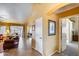 Hallway leading to a living room and bedroom, showcasing tile floors at 17500 N 85Th Dr, Peoria, AZ 85382