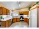 Well-maintained kitchen featuring tile floors, stainless steel appliances, and plenty of cabinet space at 17500 N 85Th Dr, Peoria, AZ 85382