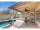 Cozy covered patio featuring view of pool and desert landscaped backyard at 17500 N 85Th Dr, Peoria, AZ 85382