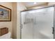 Bathroom shower featuring glass doors, neutral-toned walls, and updated hardware for a spa-like experience at 17500 N 85Th Dr, Peoria, AZ 85382