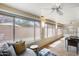 Bright sunroom with tile floors, expansive windows, and comfortable seating areas, perfect for relaxation at 17500 N 85Th Dr, Peoria, AZ 85382