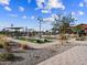 Community area with a playground, lawn game space, BBQ station, and shaded seating at 17576 W Adams St, Goodyear, AZ 85338
