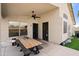 Back patio with a table, ceiling fan, and views of the fenced yard, with dual entries into the house at 20017 N 65Th Dr, Glendale, AZ 85308