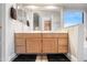 Bathroom boasts dual sinks, wooden cabinets, and a bright, spacious environment at 20017 N 65Th Dr, Glendale, AZ 85308