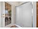 This bathroom showcases a frosted glass shower, with a door leading to the outside patio at 20017 N 65Th Dr, Glendale, AZ 85308