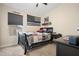 Well-lit bedroom featuring a ceiling fan, window, baseball-themed decor, and comfortable bedding at 20017 N 65Th Dr, Glendale, AZ 85308