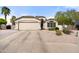 Charming single-story home with a two-car garage and desert landscaping at 20017 N 65Th Dr, Glendale, AZ 85308