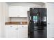 Modern kitchen features white cabinets, granite counters, and a stainless steel Samsung refrigerator at 20017 N 65Th Dr, Glendale, AZ 85308