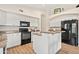 Beautiful kitchen with black appliances, white cabinets, and granite countertops at 20017 N 65Th Dr, Glendale, AZ 85308