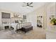 Well-lit main bedroom with carpeted floors, ceiling fan and a decorative metal bed frame at 20017 N 65Th Dr, Glendale, AZ 85308