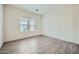 Spacious bedroom with tile flooring, neutral walls, and a bright window at 2206 S Ellsworth Rd # 129B, Mesa, AZ 85201