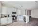 Modern kitchen featuring stainless steel appliances, white cabinets, and a breakfast bar at 2206 S Ellsworth Rd # 129B, Mesa, AZ 85201