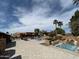Resort-style community pool area with lounge chairs, waterfall features, and lush landscaping in a beautiful outdoor space at 2206 S Ellsworth Rd # 129B, Mesa, AZ 85201