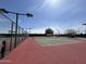 Community tennis court featuring lighting and a well-maintained surface for residents to enjoy the game at 2206 S Ellsworth Rd # 129B, Mesa, AZ 85201