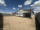 A partially fenced backyard of an in-progress home on a sunny day at 2385 E Spur Dr, San Tan Valley, AZ 85140
