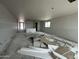 An interior view of a large living room with drywall in progress and a sink at 2385 E Spur Dr, San Tan Valley, AZ 85140