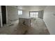 A large living room interior with drywall, a sink, and a large window at 2385 E Spur Dr, San Tan Valley, AZ 85140
