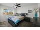 Well-lit bedroom featuring a ceiling fan, carpeted floors and a window with blinds at 2539 E Geneva Dr, Tempe, AZ 85282