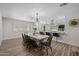 Dining area open to a beautifully updated kitchen with a large island and stainless steel appliances at 2539 E Geneva Dr, Tempe, AZ 85282