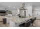 Spacious kitchen featuring a large island with bar seating, stainless steel appliances, and modern design at 2539 E Geneva Dr, Tempe, AZ 85282