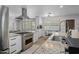 Modern kitchen with stainless steel appliances, granite countertops, and ample counter space at 2539 E Geneva Dr, Tempe, AZ 85282