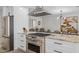 Updated kitchen with stainless appliances, granite counters, and open layout to dining area at 2539 E Geneva Dr, Tempe, AZ 85282