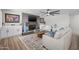Cozy living room featuring a brick fireplace, built-in cabinets, and stylish decor at 2539 E Geneva Dr, Tempe, AZ 85282
