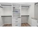 Spacious walk-in closet features custom shelving, drawers and ample storage space at 2539 E Geneva Dr, Tempe, AZ 85282