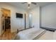 Bright bedroom with a ceiling fan, light walls, neutral accents, and convenient access to a walk-in closet at 2949 E Athena Ave, Gilbert, AZ 85297