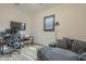 Cozy bedroom features a workspace, a plush daybed, and a ceiling fan for added comfort at 2949 E Athena Ave, Gilbert, AZ 85297