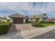 Beautiful home with a brick driveway, two-car garage, and lush landscaping at 2949 E Athena Ave, Gilbert, AZ 85297