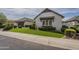 Beautiful home featuring well-manicured landscaping, green lawn and a two car garage at 2949 E Athena Ave, Gilbert, AZ 85297