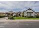 Charming home with a well-manicured lawn, mature landscaping, and a two-car garage at 2949 E Athena Ave, Gilbert, AZ 85297