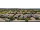 Aerial shot of a well-maintained home with a manicured front yard, driveway, and other neighborhood properties at 2949 E Athena Ave, Gilbert, AZ 85297