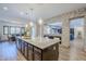 Spacious kitchen with a large island, granite countertops, and stone accents at 2949 E Athena Ave, Gilbert, AZ 85297