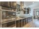 The kitchen has a gas cooktop, stainless appliances, and sleek cabinetry for a modern aesthetic at 2949 E Athena Ave, Gilbert, AZ 85297