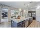Gourmet kitchen with granite island, stainless appliances, and stone design feature at 2949 E Athena Ave, Gilbert, AZ 85297