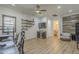 Inviting living room with sleek flooring, ceiling fan, and stylish built in bar area, perfect for relaxation and entertaining at 2949 E Athena Ave, Gilbert, AZ 85297