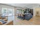Comfortable living room with large sliding glass doors, built-in cabinets, and a cozy bar area at 2949 E Athena Ave, Gilbert, AZ 85297