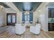 Open-concept living room with blue accent ceiling, modern chandelier, and sitting area at 2949 E Athena Ave, Gilbert, AZ 85297