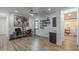 Bright and airy living room featuring sleek floors, a ceiling fan, a built-in bar, and ample space at 2949 E Athena Ave, Gilbert, AZ 85297