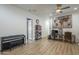 Spacious living area features sleek flooring, ceiling fan, and versatile space perfect for work or leisure at 2949 E Athena Ave, Gilbert, AZ 85297