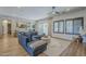 Cozy living room featuring a stone accent wall, stylish decor, and comfortable blue sofa at 2949 E Athena Ave, Gilbert, AZ 85297