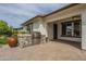 Backyard features an outdoor kitchen with stainless steel grill and stone accents at 2949 E Athena Ave, Gilbert, AZ 85297