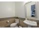 A stylish powder room features a pedestal sink, mosaic tile accents, and modern fixtures at 2949 E Athena Ave, Gilbert, AZ 85297
